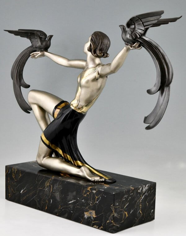 Art Deco bronze sculpture lady with birds of paradise.