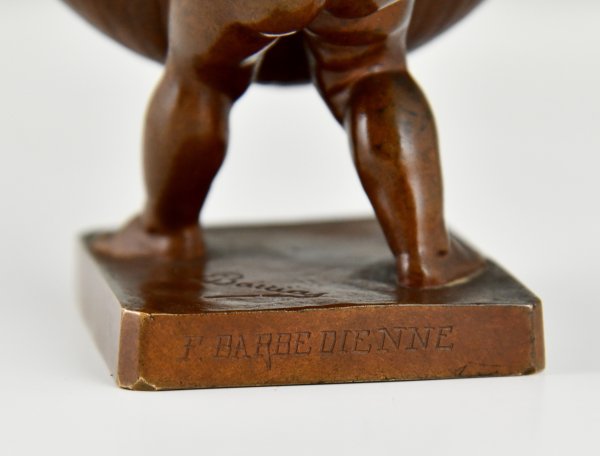 Antique bronze sculpture boy with basket.