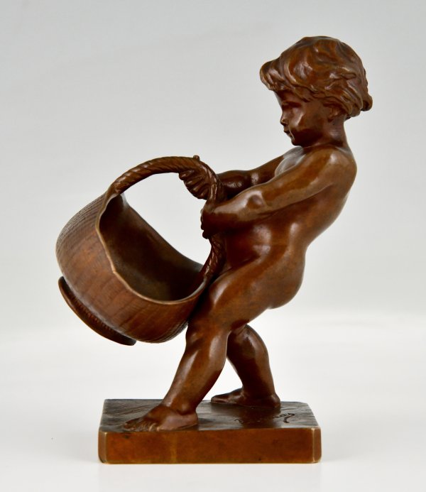 Antique bronze sculpture boy with basket.