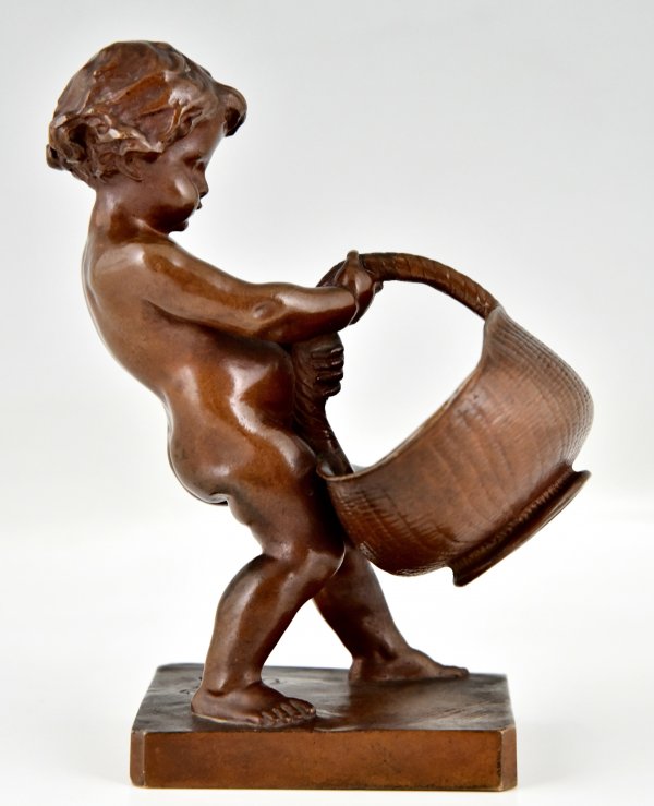 Antique bronze sculpture boy with basket.