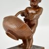 Antique bronze sculpture boy with basket.
