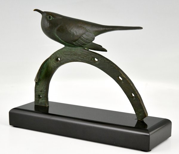 Art Deco bronzen sculptuur vogel op hoefijzer