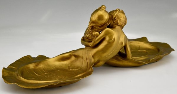 Art Nouveau bronze tray with young couple kissing.