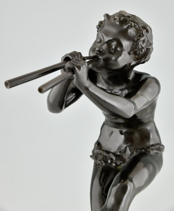 Art Deco bronze sculpture dancing faun with flutes.