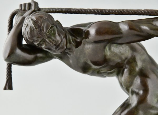 Art Deco bronze sculpture athlete pulling a rope.