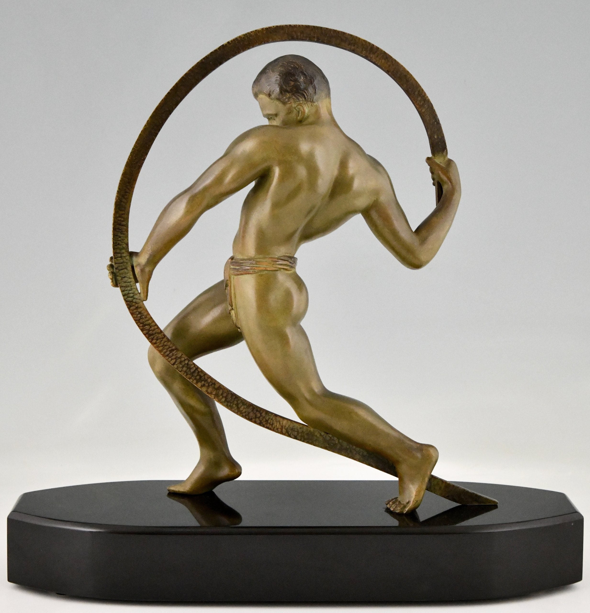 Art Deco sculpture of an athlete.