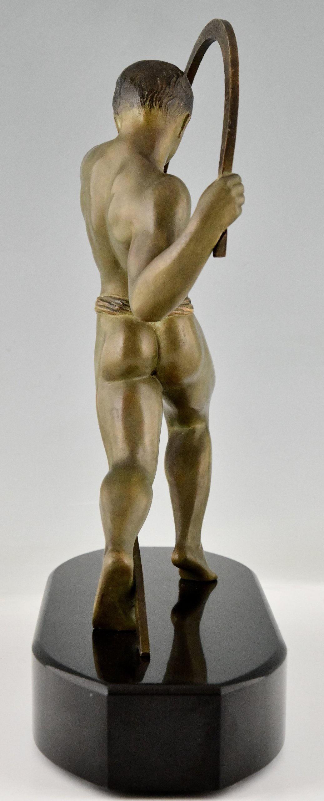 Art Deco sculpture of an athlete.