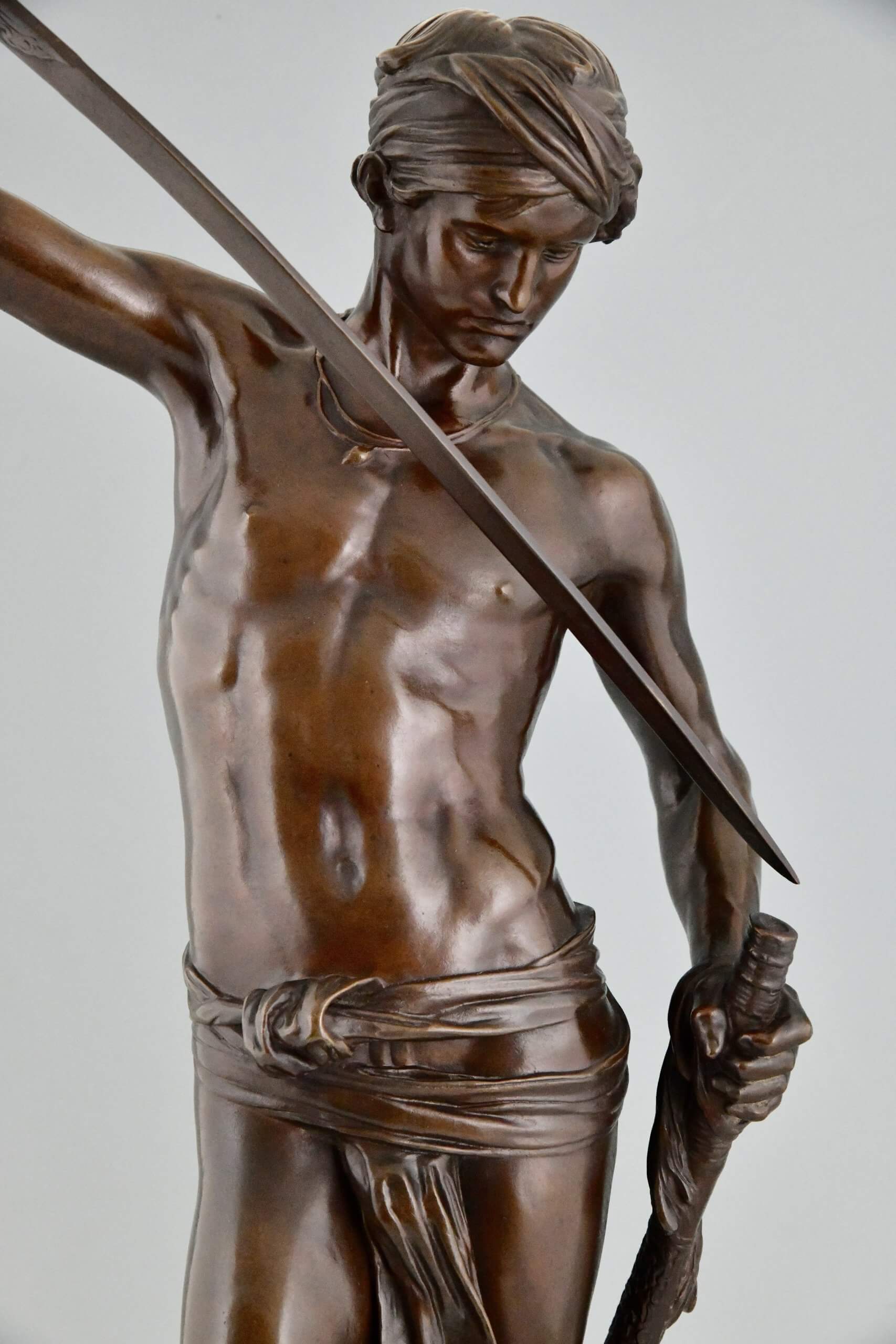 Antique bronze sculpture David after the combat.
