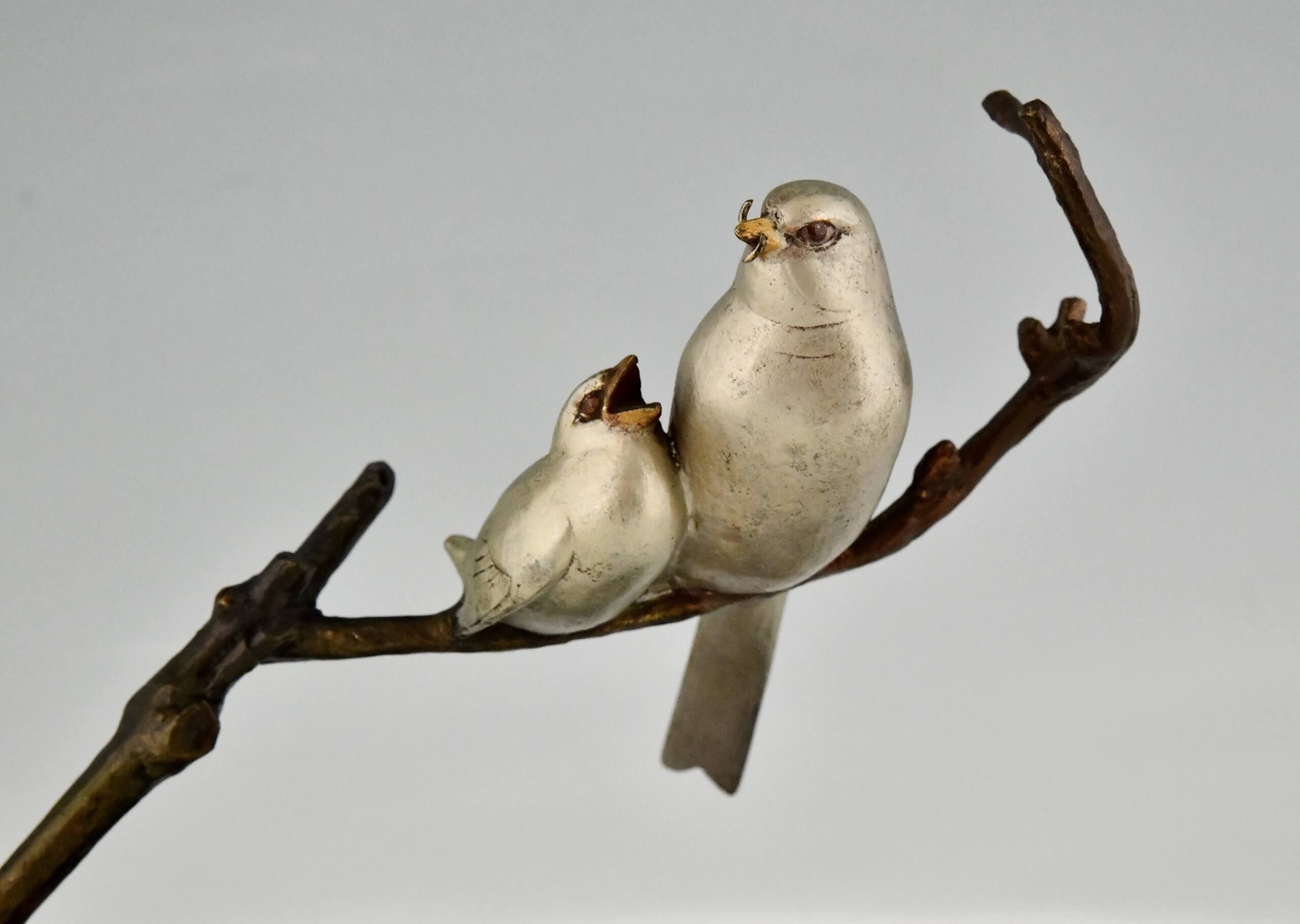 Art Deco sculpture birds on a branch.