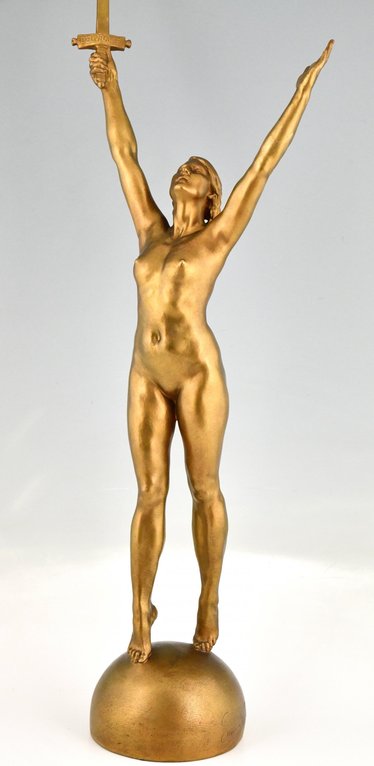 Deliverance  bronze sculpture nude with sword.