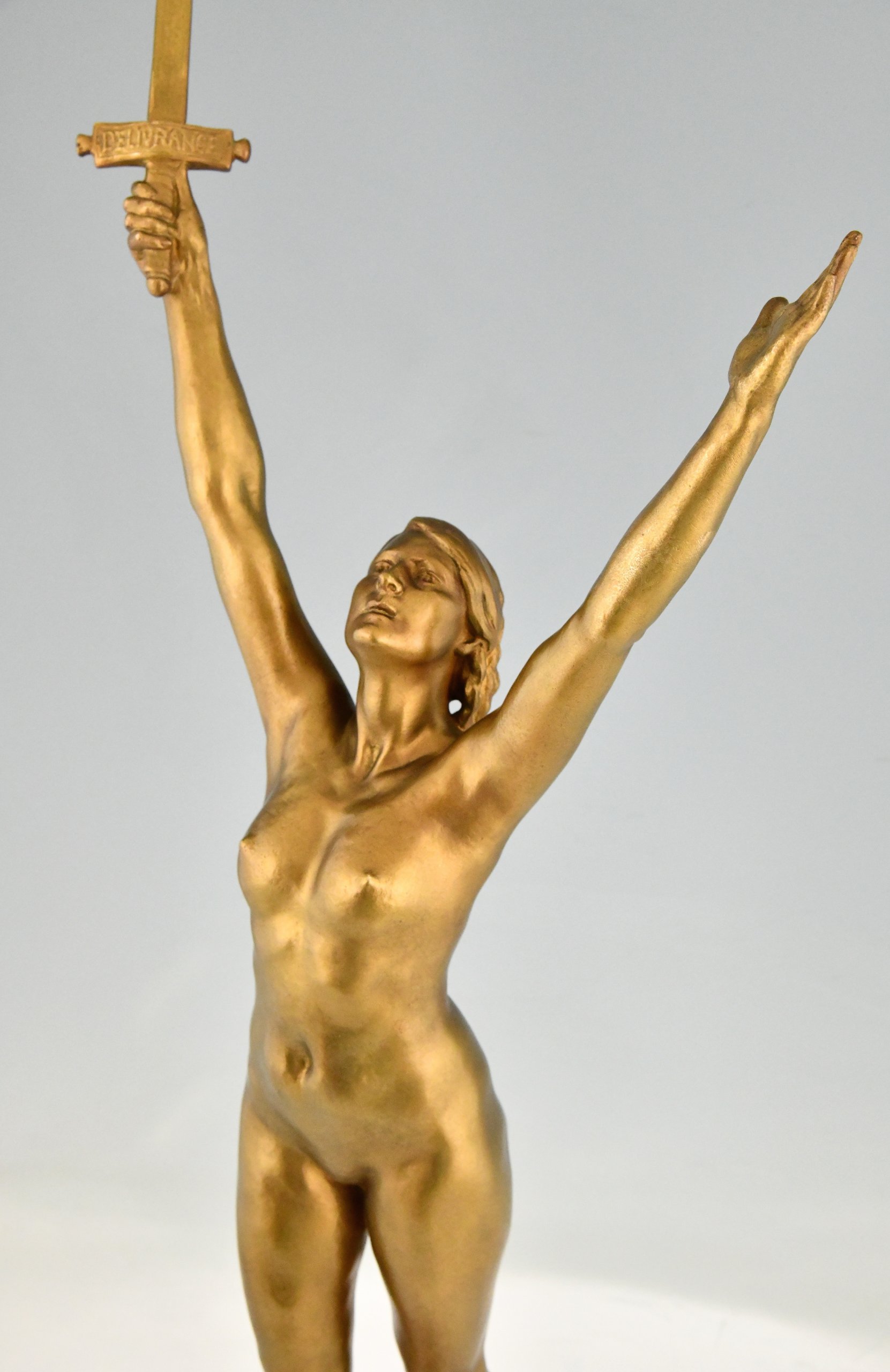 Deliverance  bronze sculpture nude with sword.