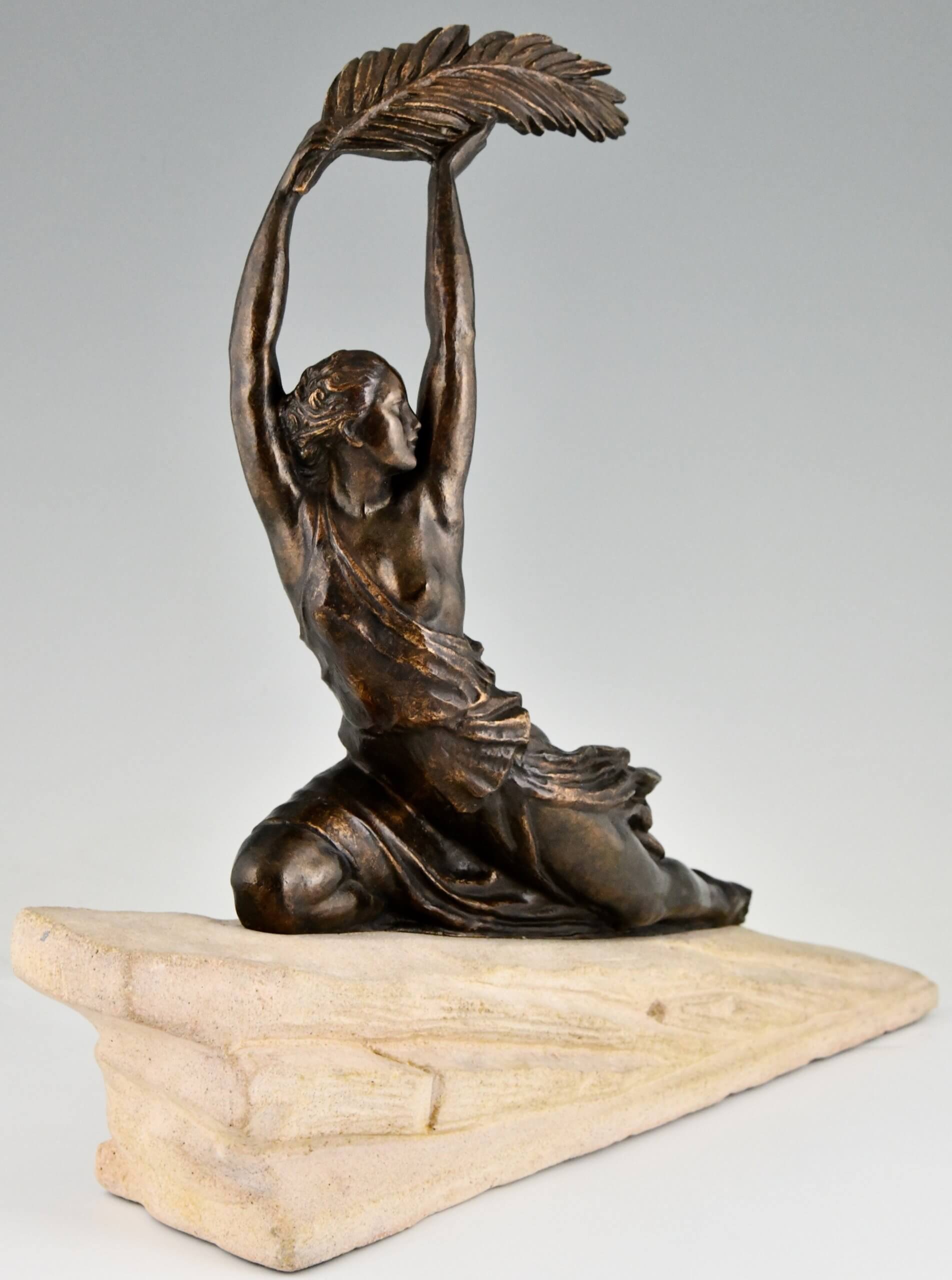 Art Deco bronze sculpture female athlete with palm leaf.