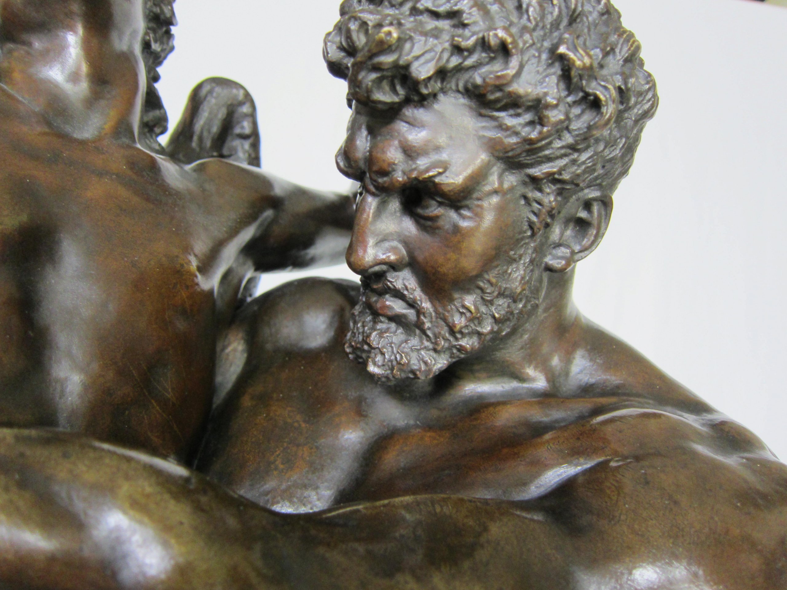 Antique bronze sculpture Genius and brute force.