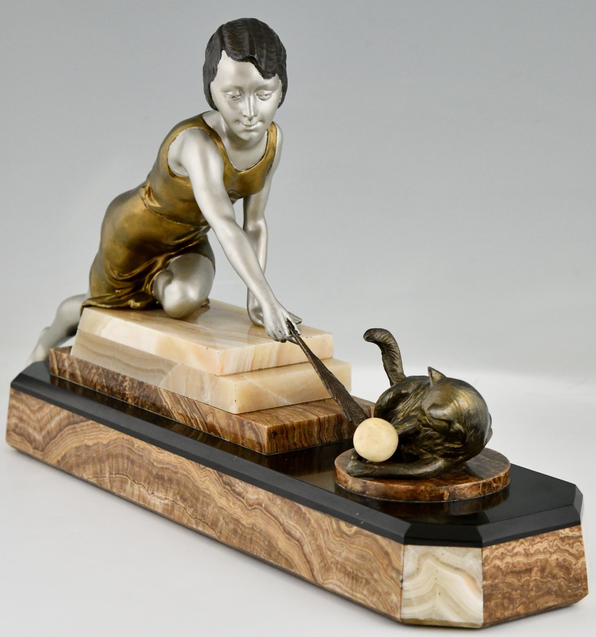 Art Deco sculpture of a girl playing with a cat