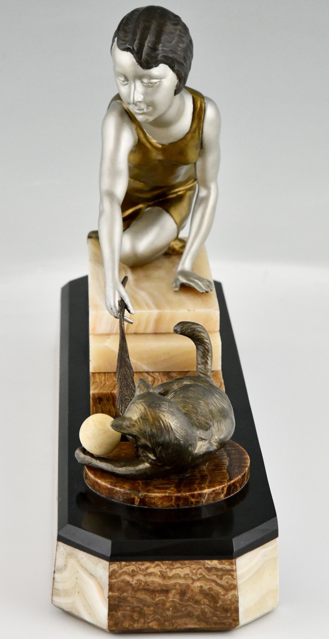 Art Deco sculpture of a girl playing with a cat