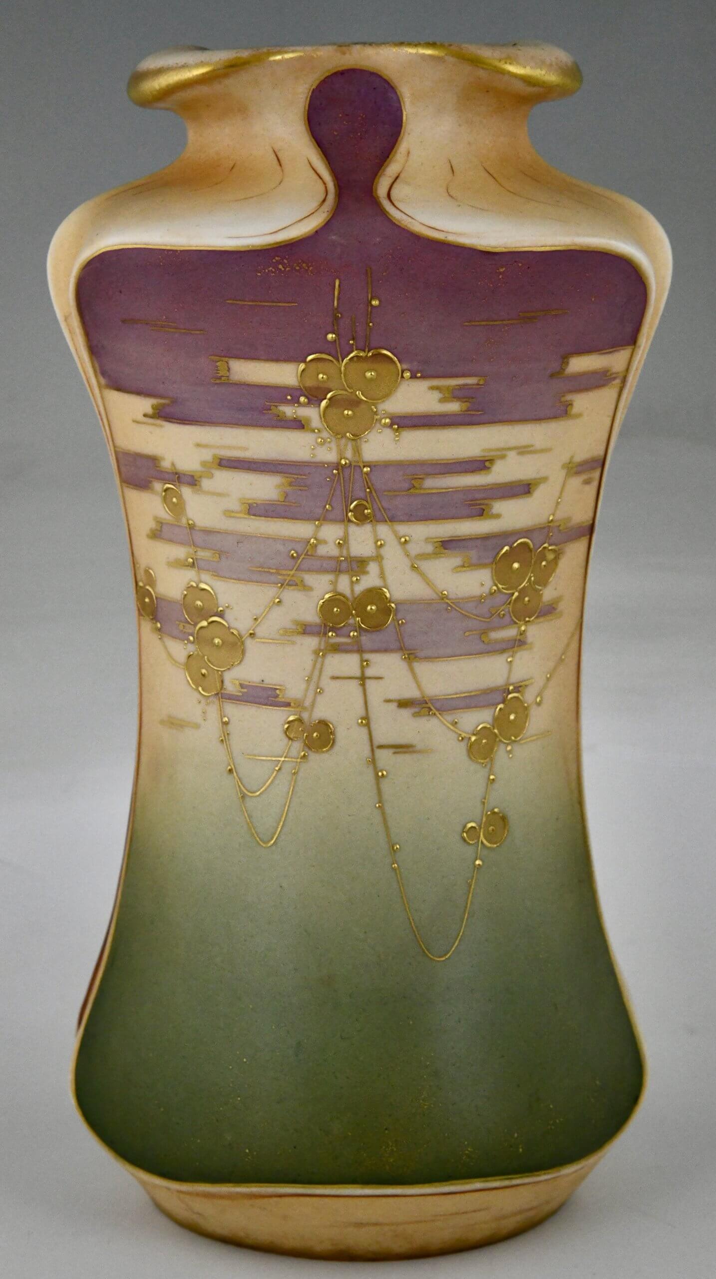 Art Nouveau ceramic vases with gilt flowers.
