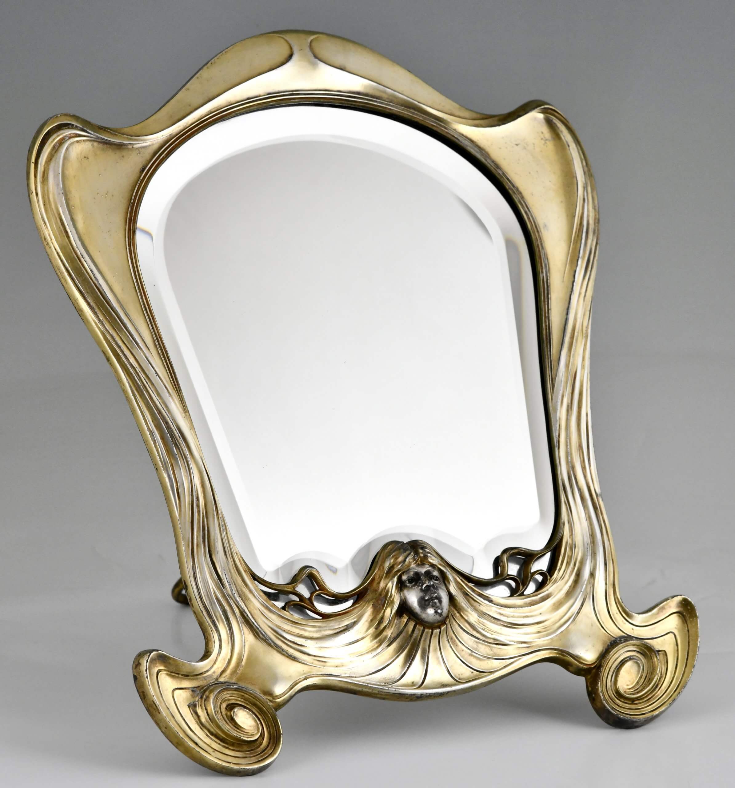 Art Nouveau mirror with face of a woman