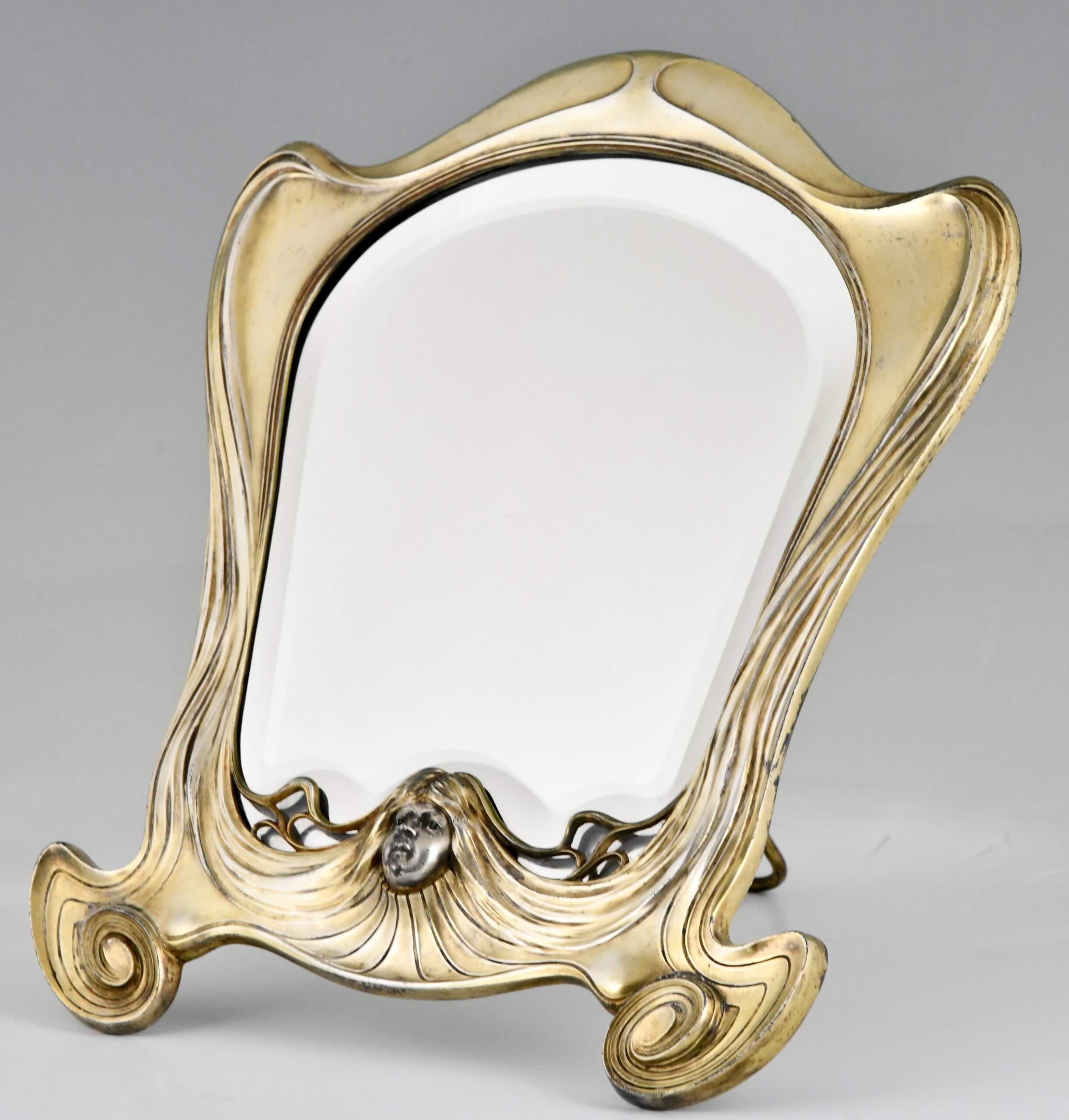 Art Nouveau spiegel met gezicht van een vrouw