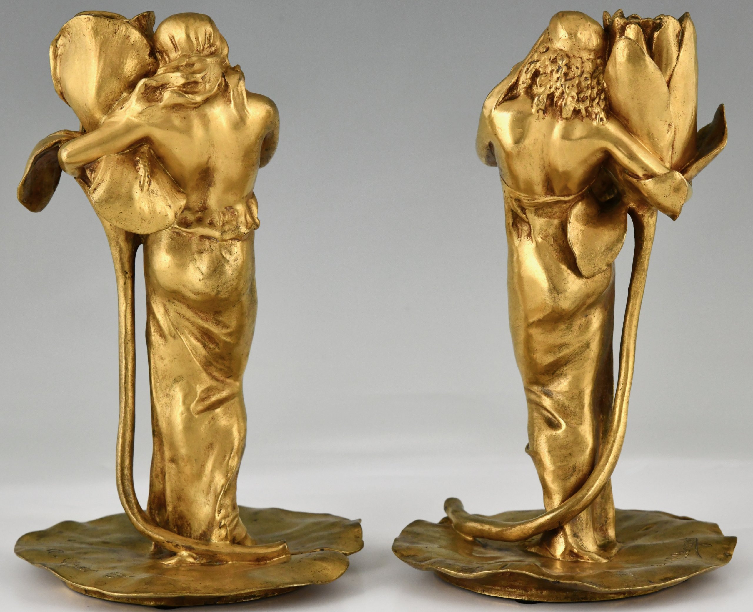 Pair of Art Nouveau bronze candlesticks lady with flower Iris and Lotus