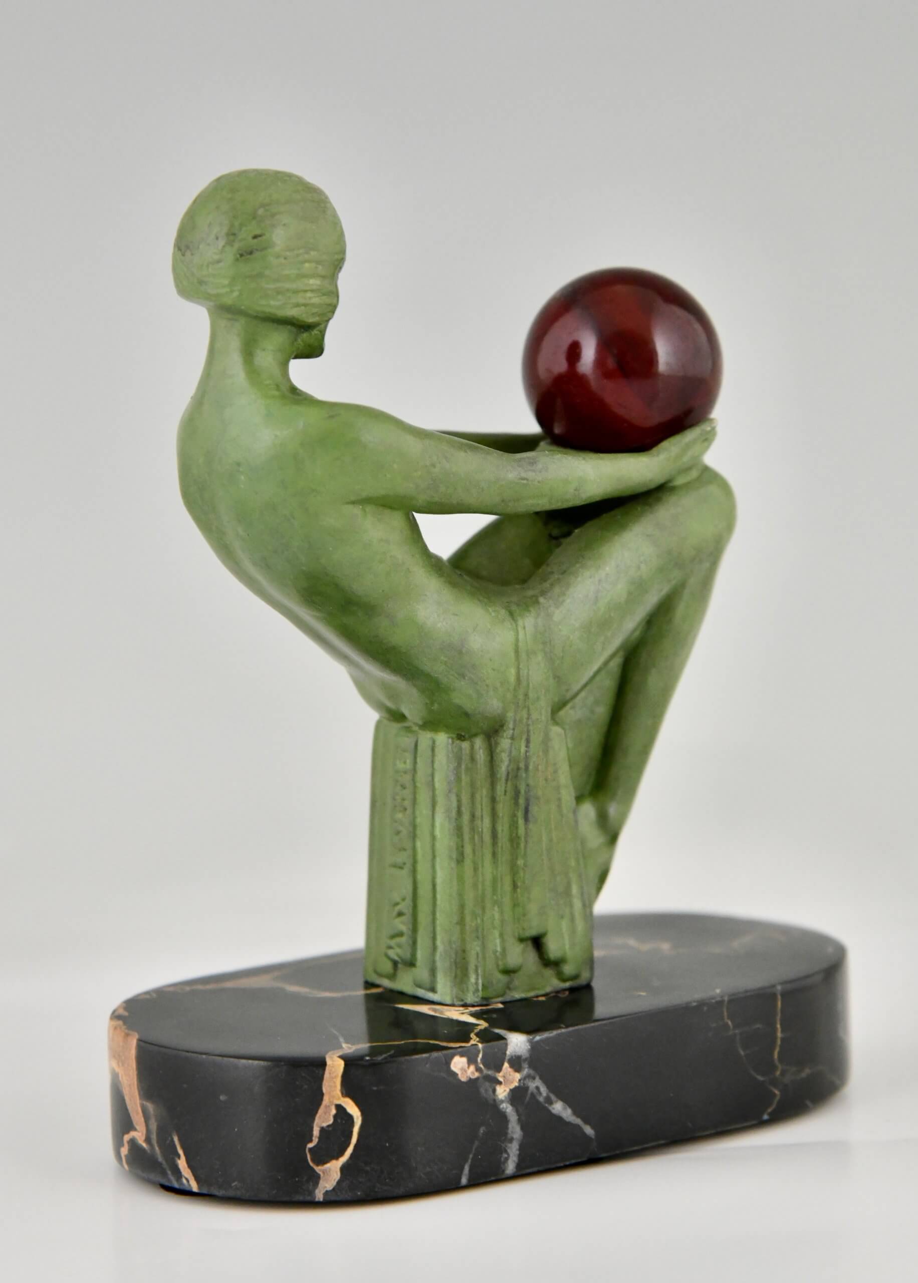 Art Deco sculpture seated nude with ball